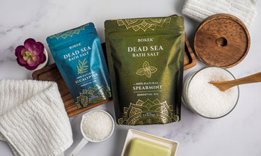 Bokek organic dead sea salt bags on a marble surface