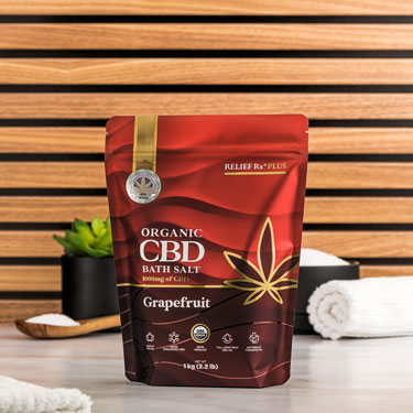 Organic CBD grapefruit scented bath salts on a bathroom counter - 1kg bag