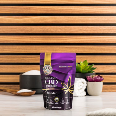 Organic CBD lavender scented bath salts on a bathroom counter - 250g pouch