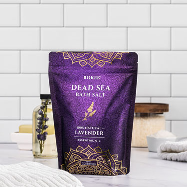 Organic Lavender dead sea bath salts on a bathroom counter - 2.2 lb bag
