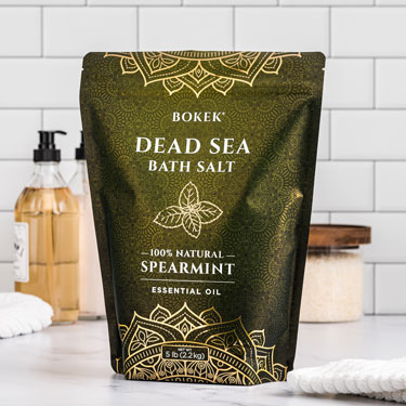 Organic Spearmint dead sea bath salts on a bathroom counter 5 lb bag